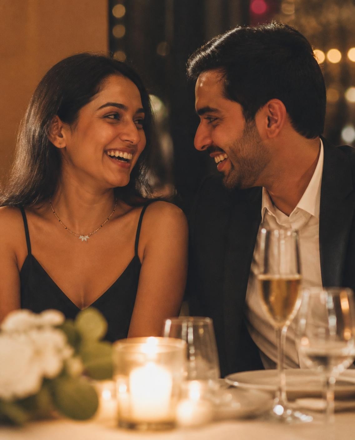Illustrative example of a first anniversary photo added to a Piece Passport, a couple laughing at a candlelit dinner