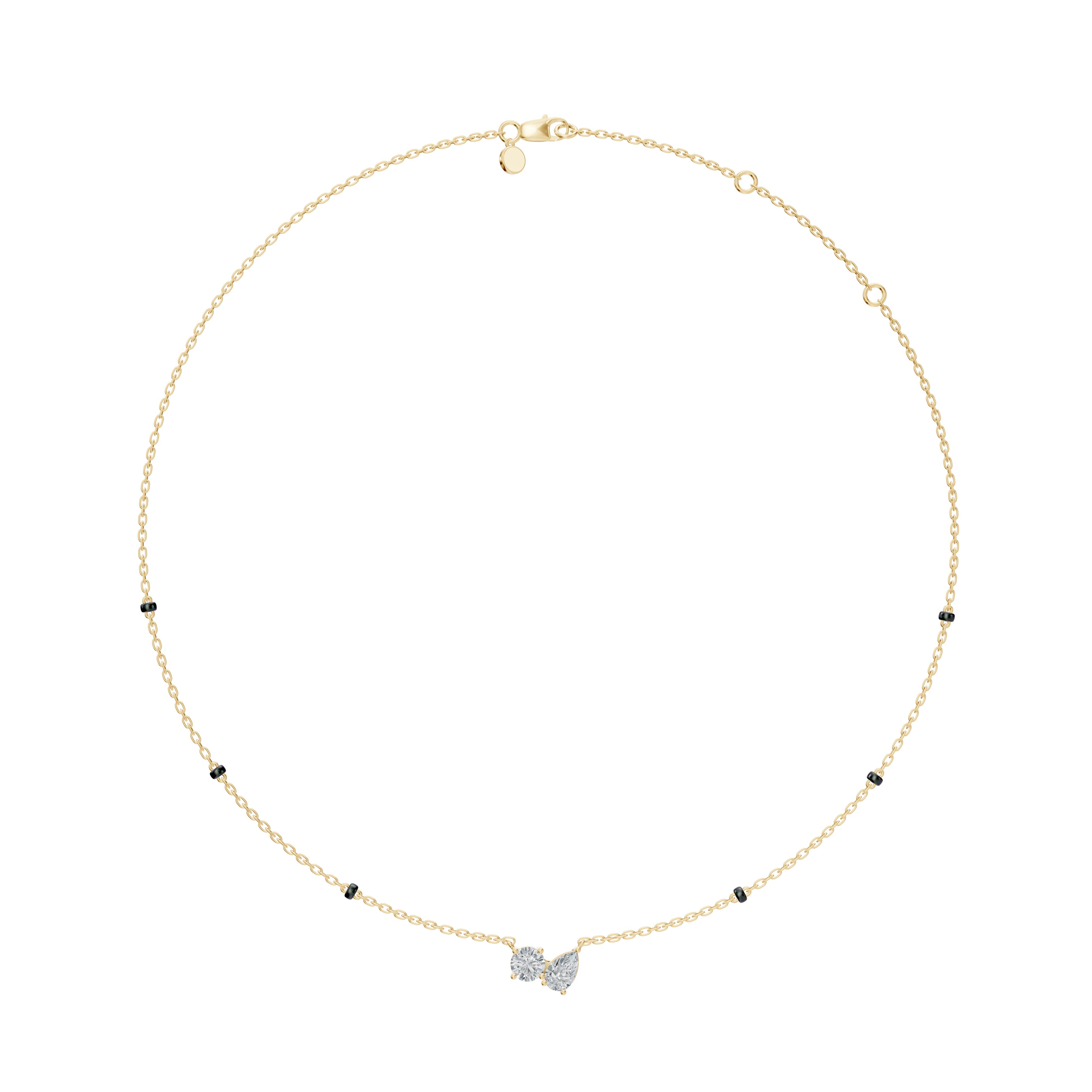 Flat lay of the yellow gold Modern Mangal Amari Mangalsutra showing the full-length design with a Toi et Moi pendant, combining pear and round diamonds on dual bead strands.