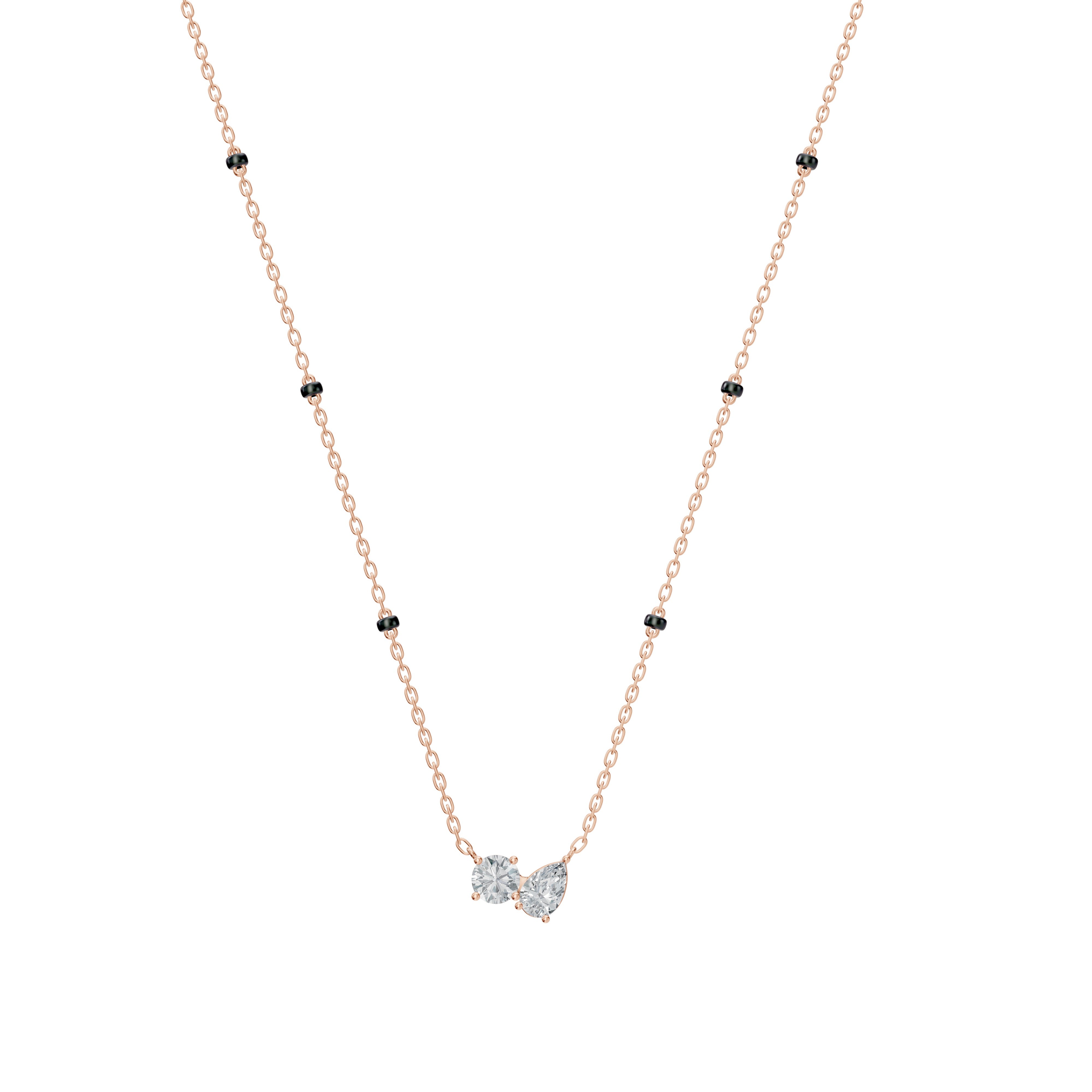 Front view of the Modern Mangal Amari Mangalsutra in rose gold, showcasing the asymmetrical Toi et Moi diamond pendant and dual-strand black bead chain.