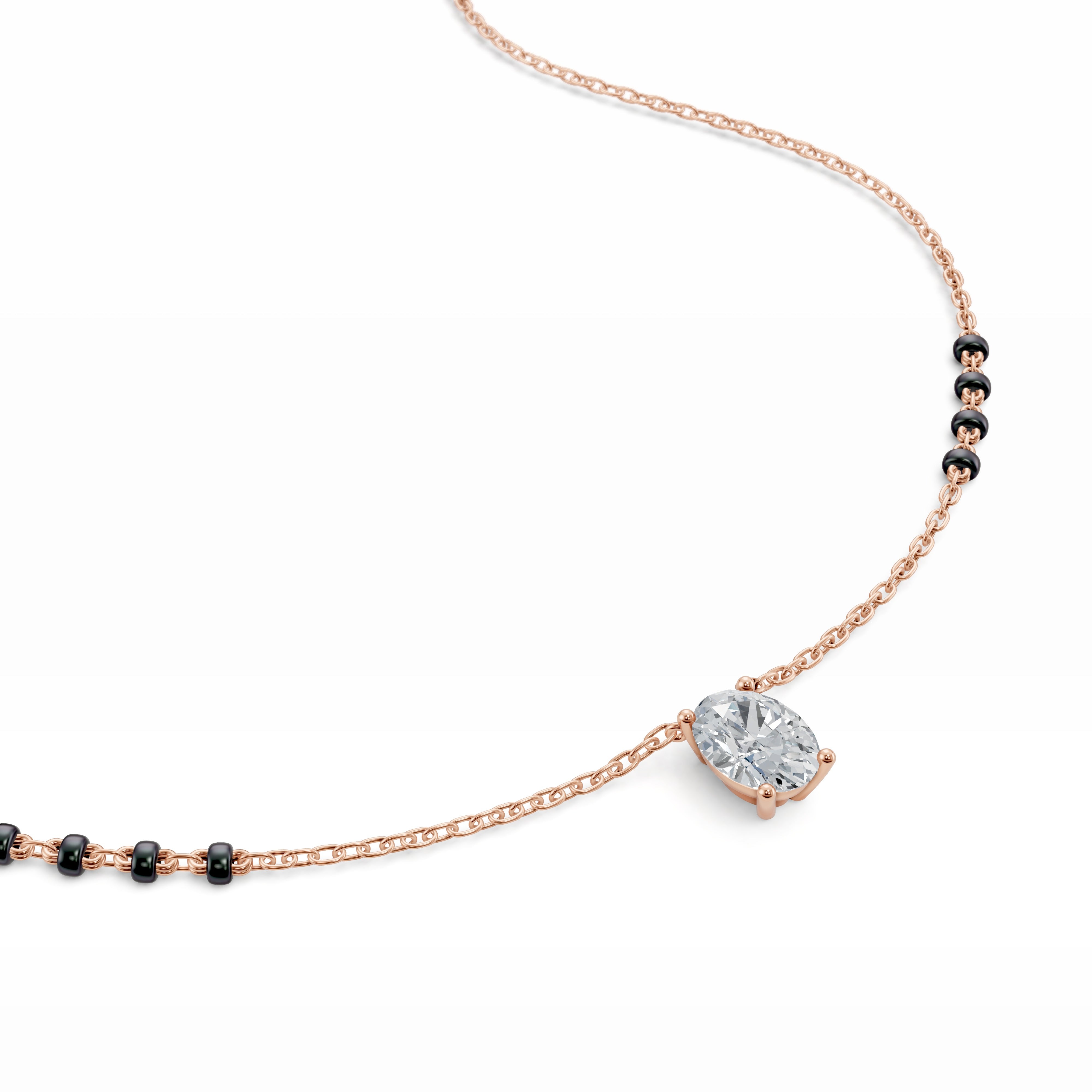 Detailed shot of the rose gold Modern Mangal Ami Mangalsutra pendant, showcasing the vertical orientation of the oval-cut diamond and warm-toned setting.
