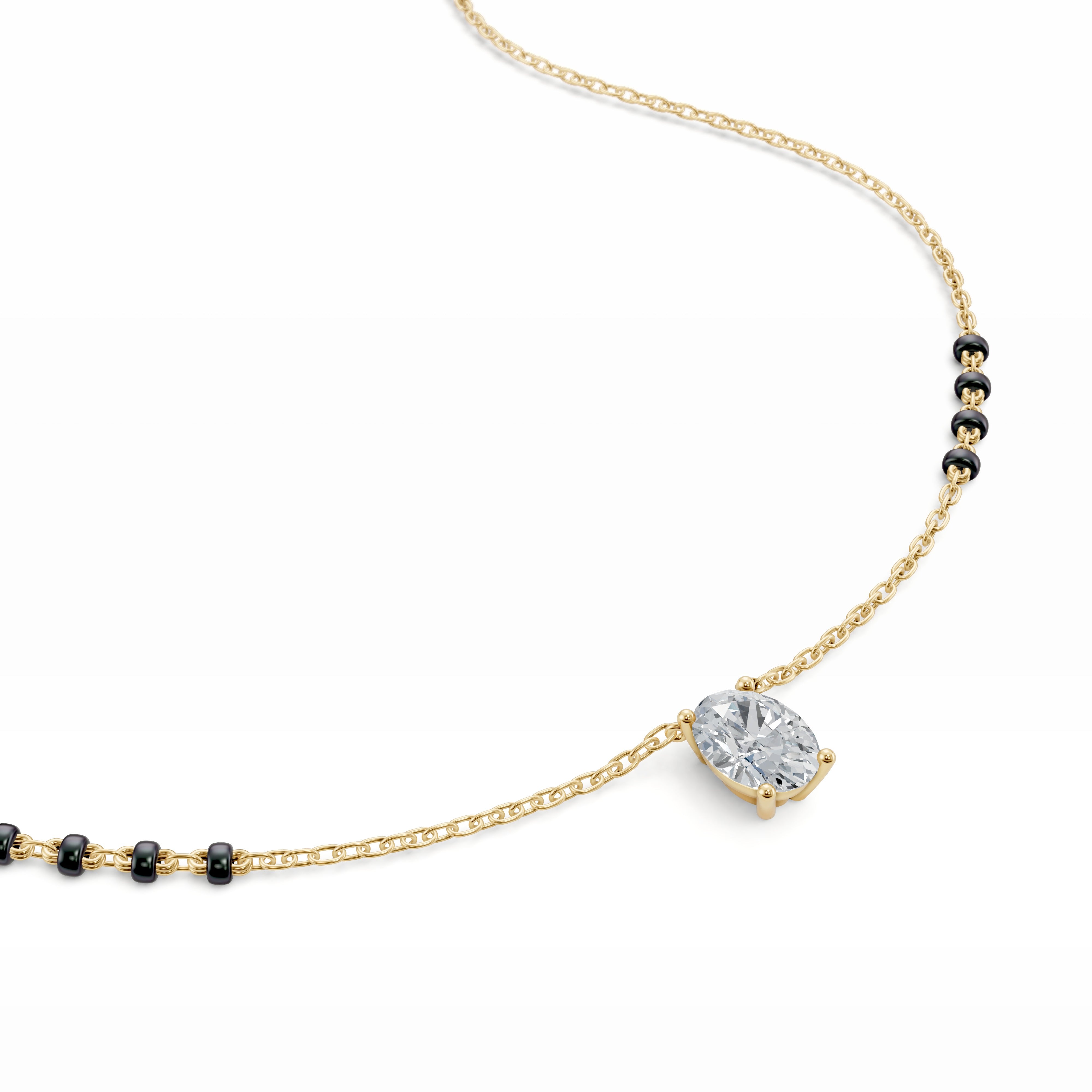 Close-up of the vertically set oval diamond pendant in the yellow gold Modern Mangal Ami Mangalsutra, highlighting the elongated shape and radiant sparkle.