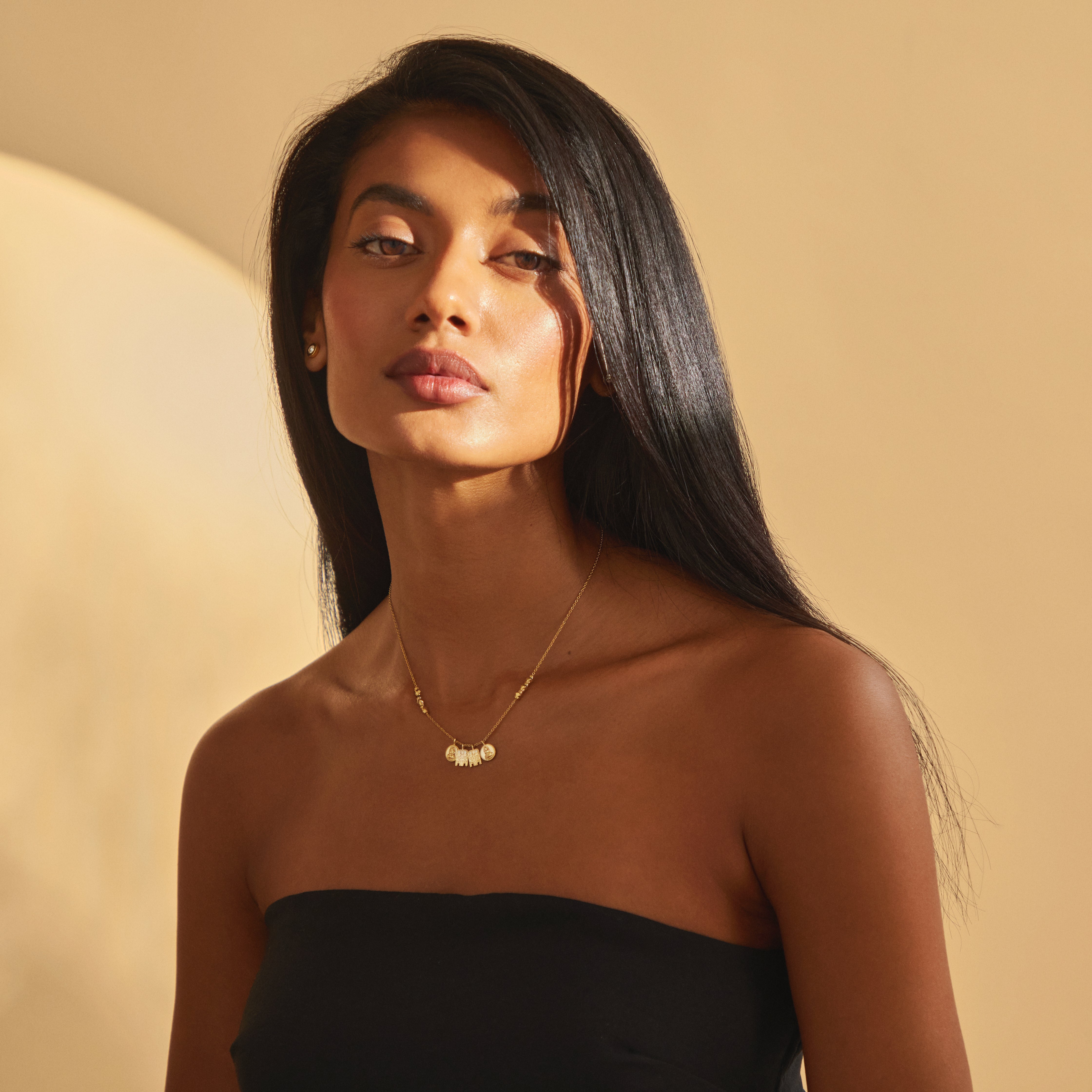 Glamour portrait of the Madhura Mangalayam modern mangalsutra necklace, worn by a model, celebrating Tamil and Telugu wedding symbolism in solid 18K gold.