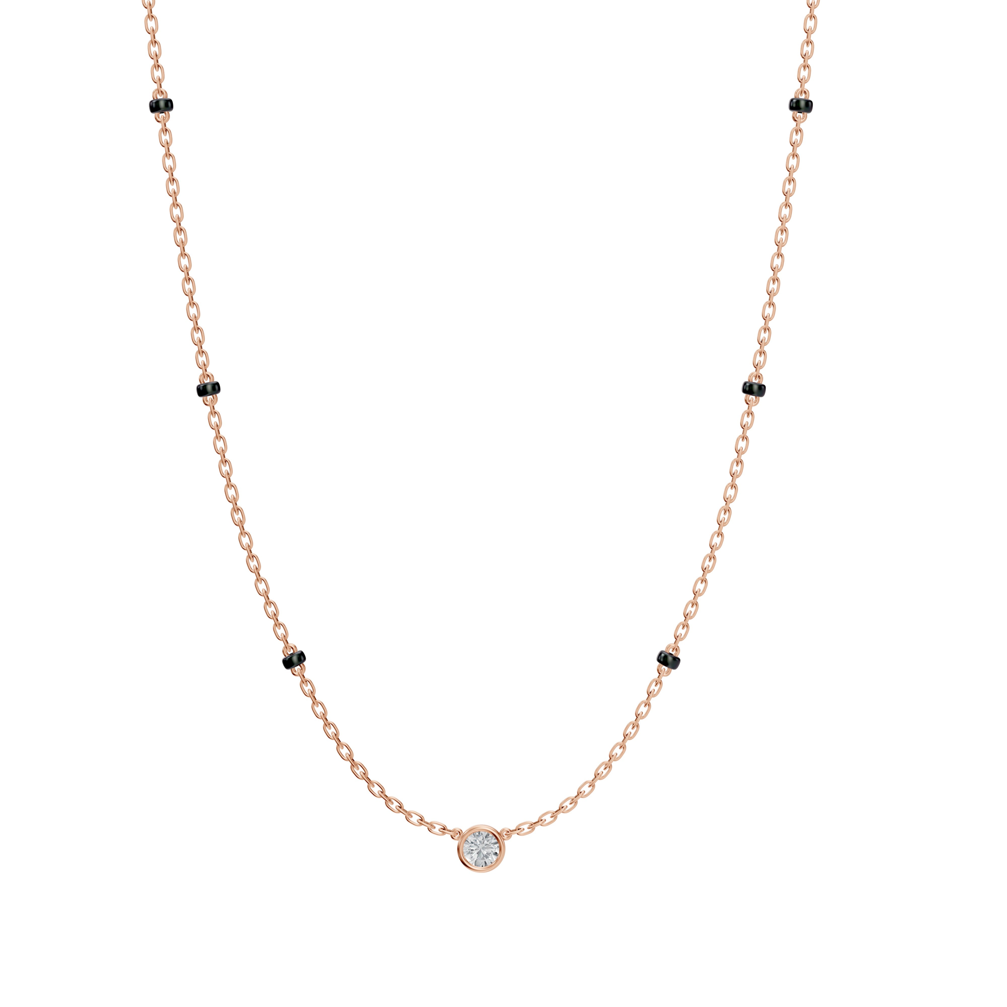 Front-facing view of the Modern Mangal Minnie Mangalsutra in rose gold, featuring a petite round diamond in a bezel setting and black bead chain with 3-bead spacing.