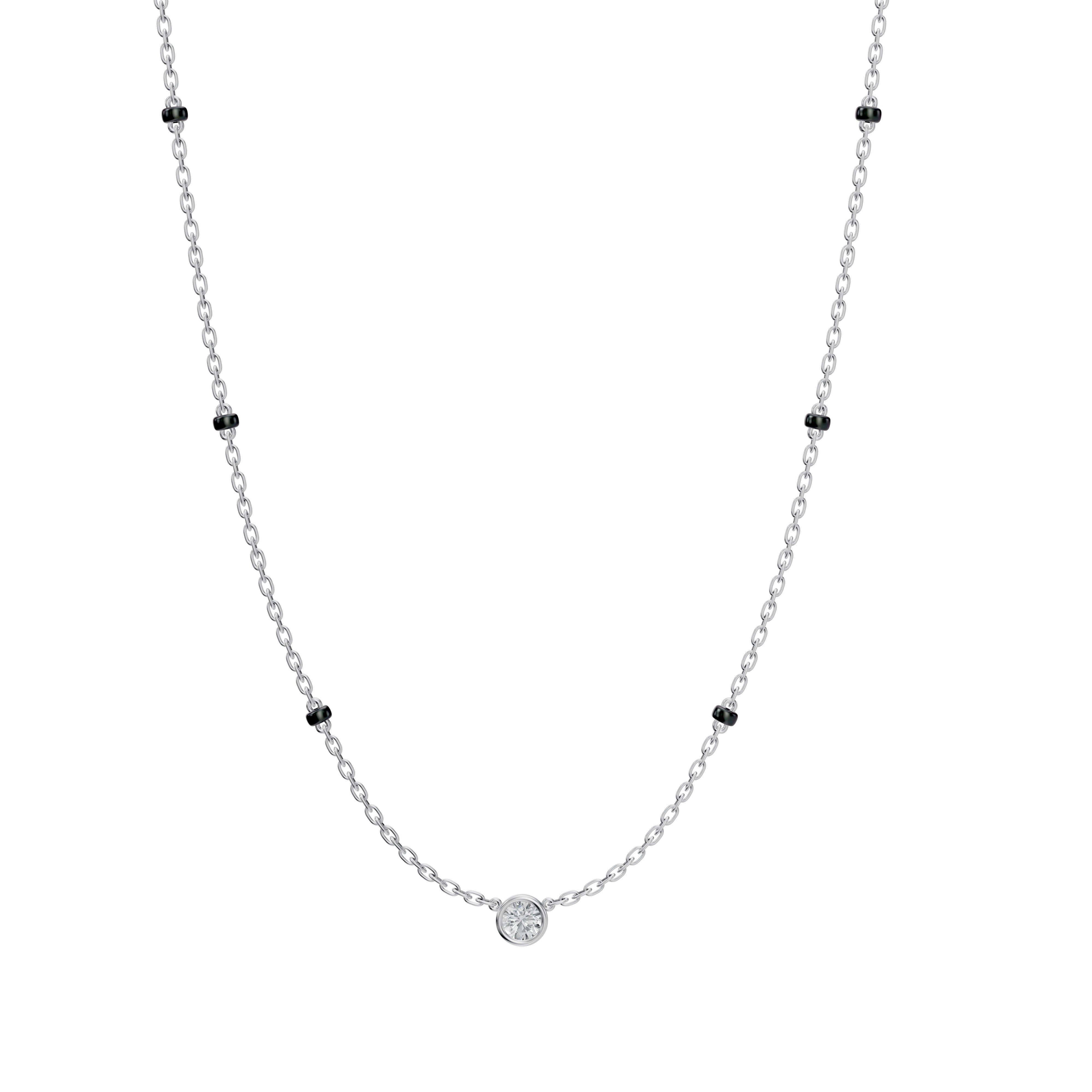 Main product image of the Modern Mangal Minnie Mangalsutra in white gold, showcasing a petite round diamond in a bezel setting and a 3-bead spaced black bead chain.