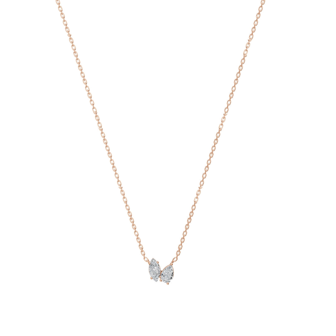  Front view of the Modern Mangal Nina Necklace Mangalsutra in rose gold, featuring a dual diamond pendant with one pear and one round diamond on black beaded chains.