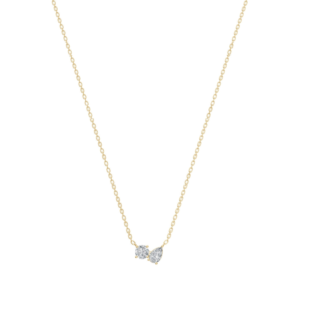 Front-facing product image of the Modern Mangal Nina Necklace Mangalsutra in yellow gold, showcasing a Toi et Moi pendant with round and pear diamonds and dual black bead chains.