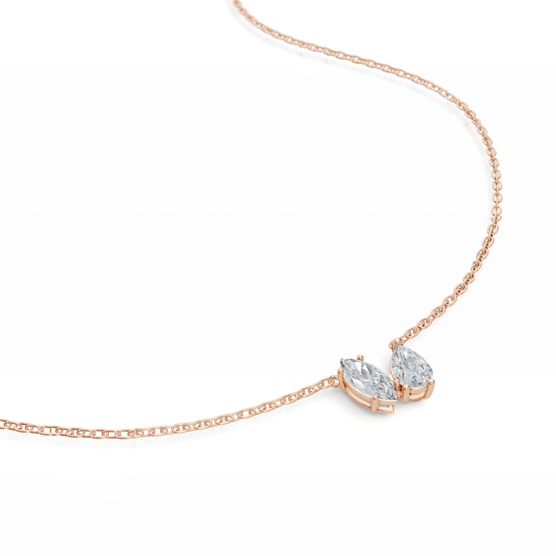Close-up of the Modern Mangal Nina pendant in rose gold, focusing on the romantic pairing of pear and round diamonds in a soft-toned Toi et Moi composition.