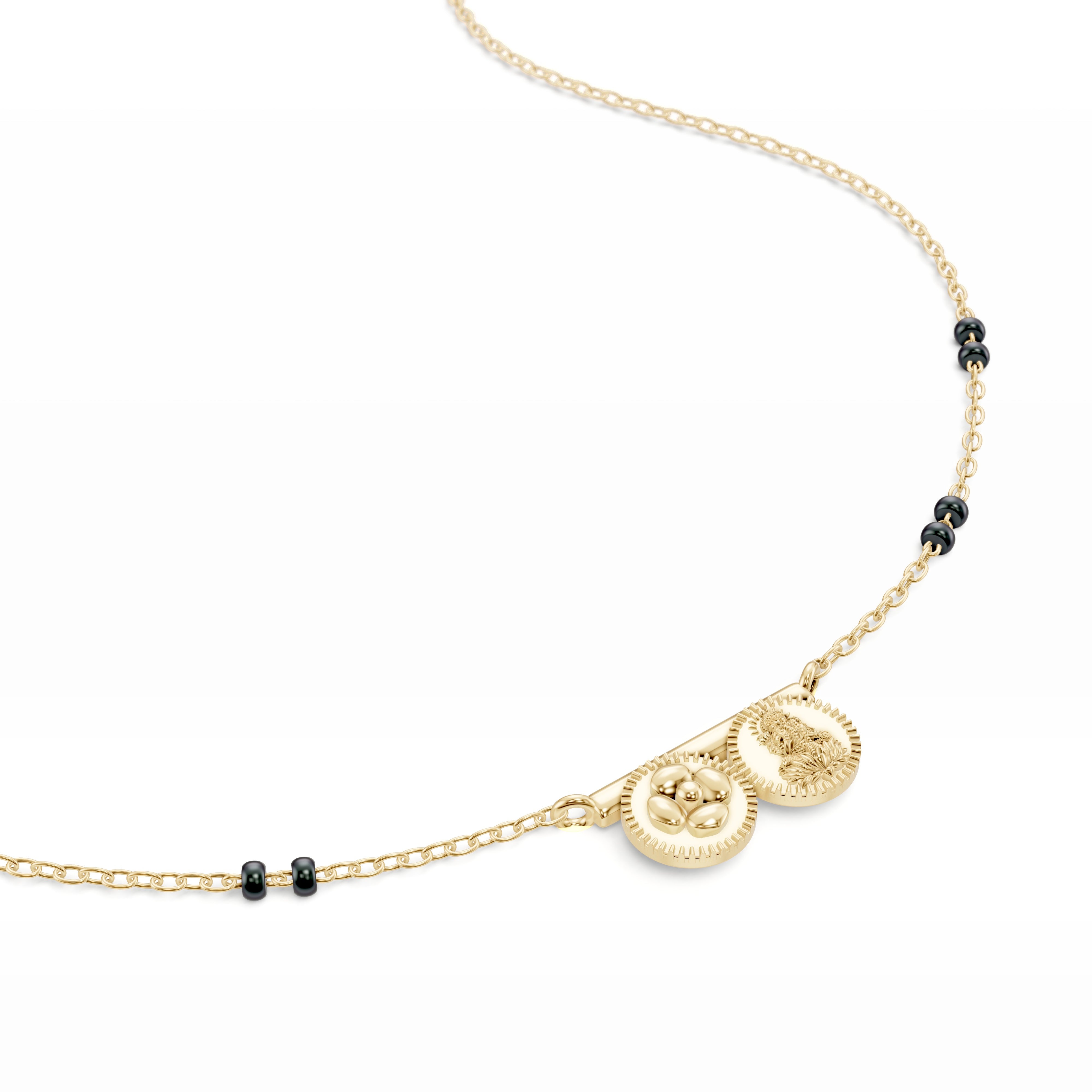 Close-up of the yellow gold Modern Mangal Saanvi Thaali pendant with one pushpa kasu and one Lakshmi kasu fixed to a gold bar, honoring Telugu bridal symbolism with elegant precision.