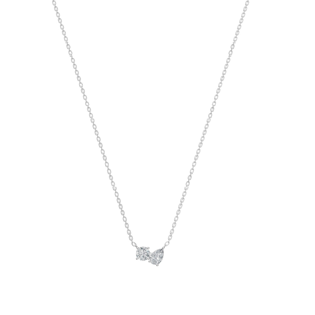 Front image of the Modern Mangal nina Necklace Mangalsutra in white gold, with a polished Toi et Moi pendant pairing a round and pear diamond, suspended on black bead chains.