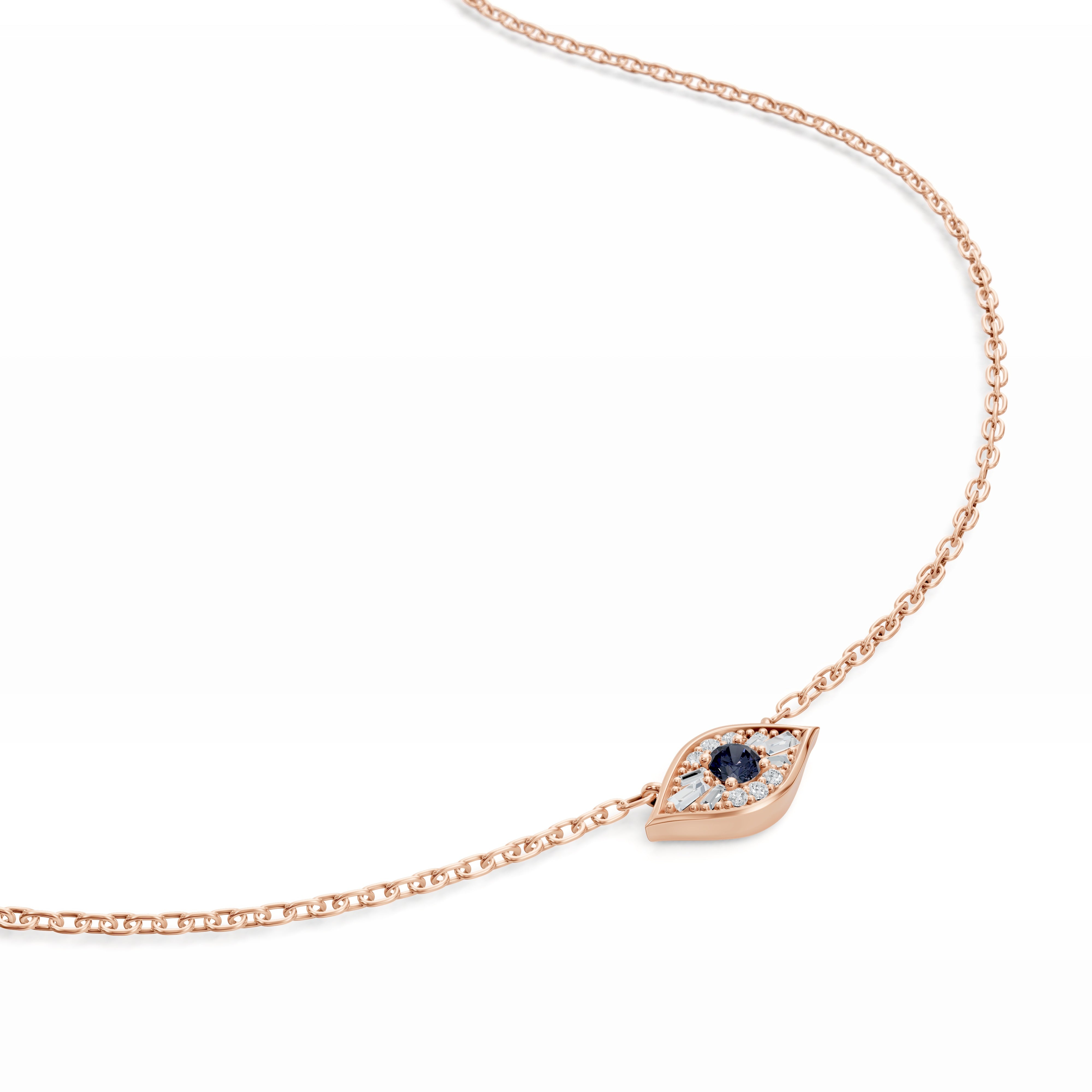 Close-up of the Modern Mangal Amina Necklace pendant in rose gold, featuring a striking sapphire center surrounded by baguette and round diamonds.