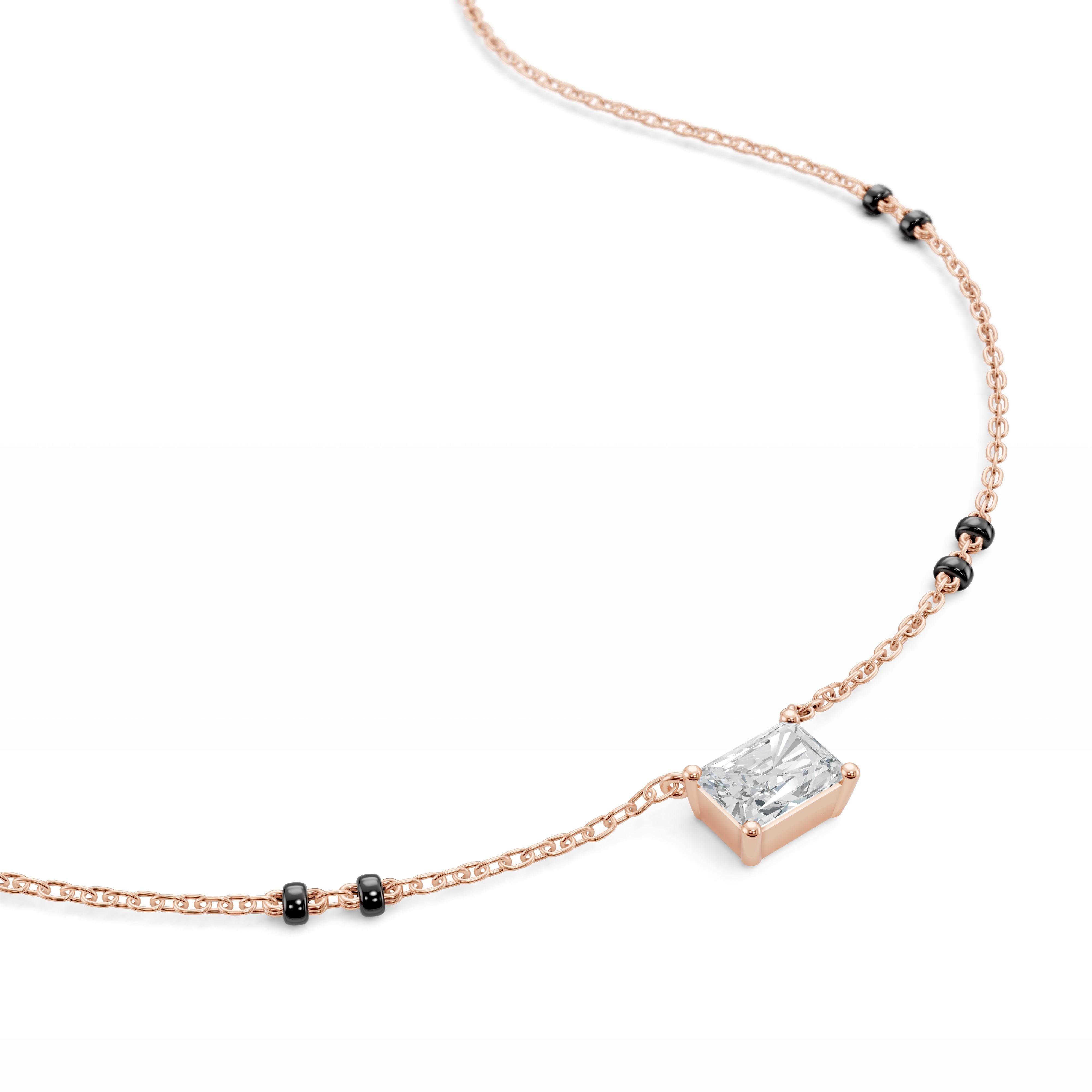 Close-up of the rose gold Modern Mangal Radhi Mangalsutra pendant, showing the east-west aligned radiant diamond with soft edges and geometric facets.