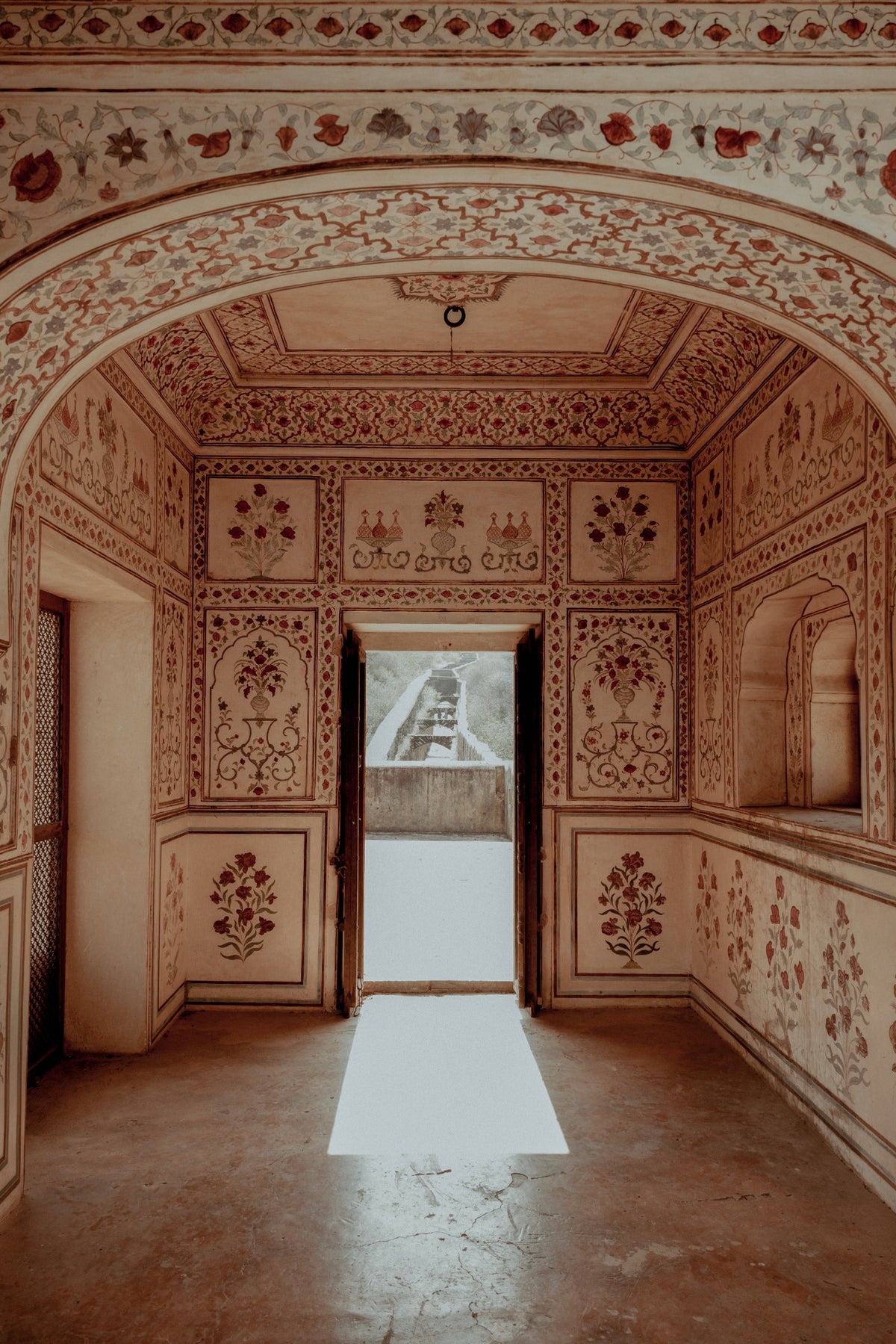 A hand-painted palace interior in Jaipur, still standing after centuries