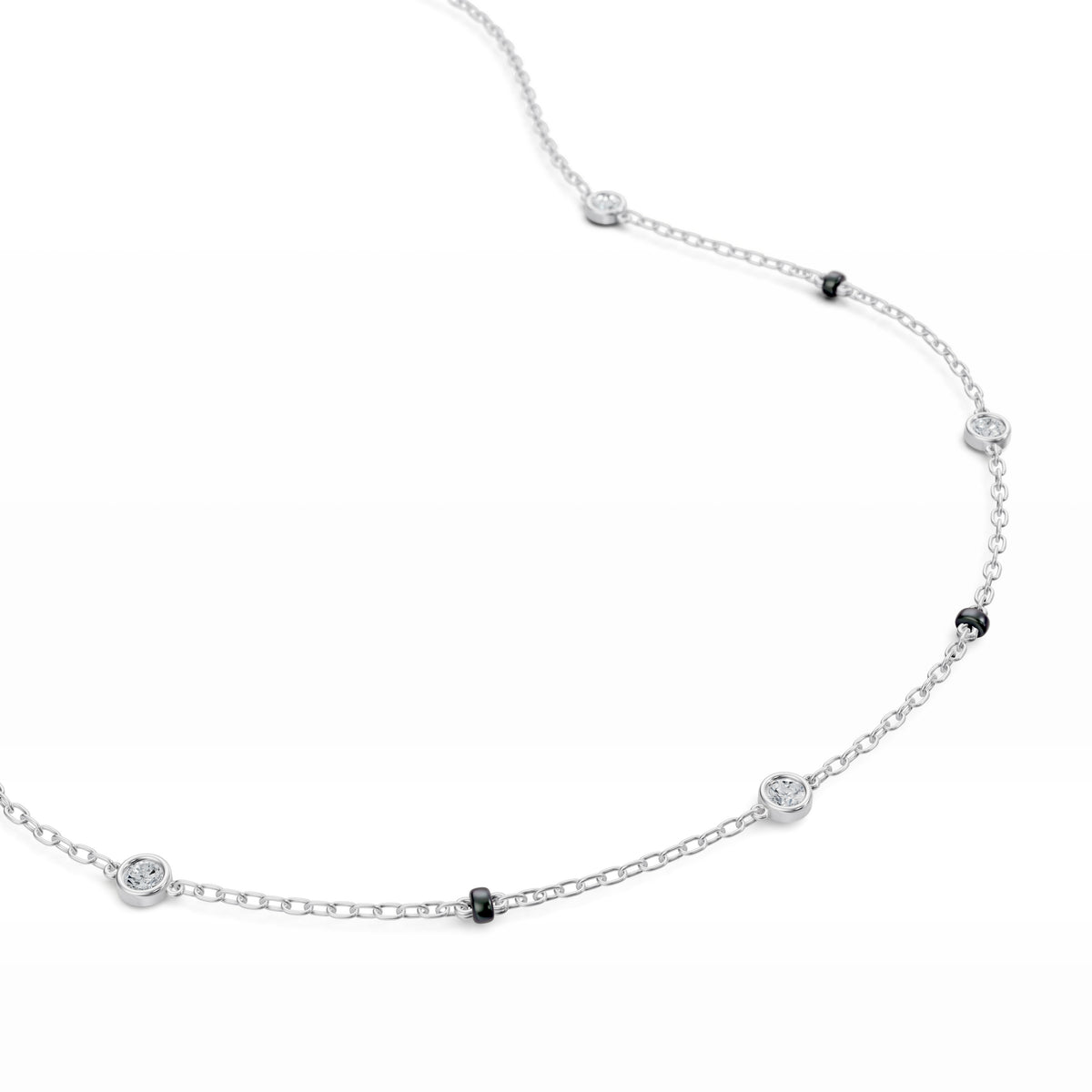 Close-up of the five bezel-set lab-grown diamonds on the Alia Mangalsutra in 18K white gold