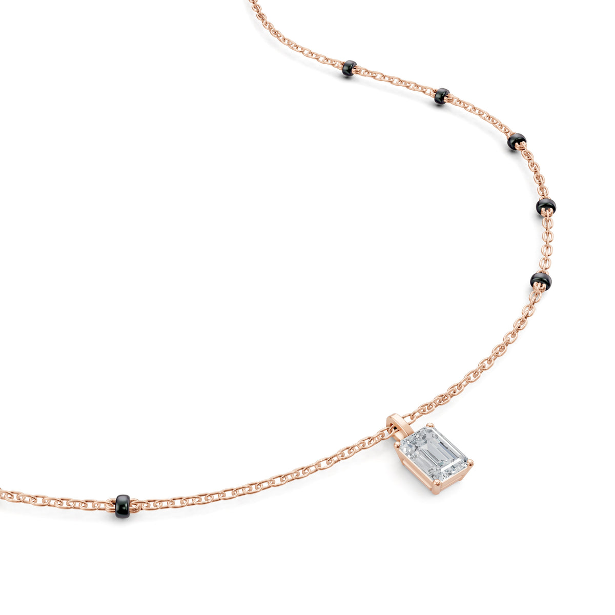 Close-up of the emerald lab-grown diamond on the Anaya Mangalsutra in 18K rose gold