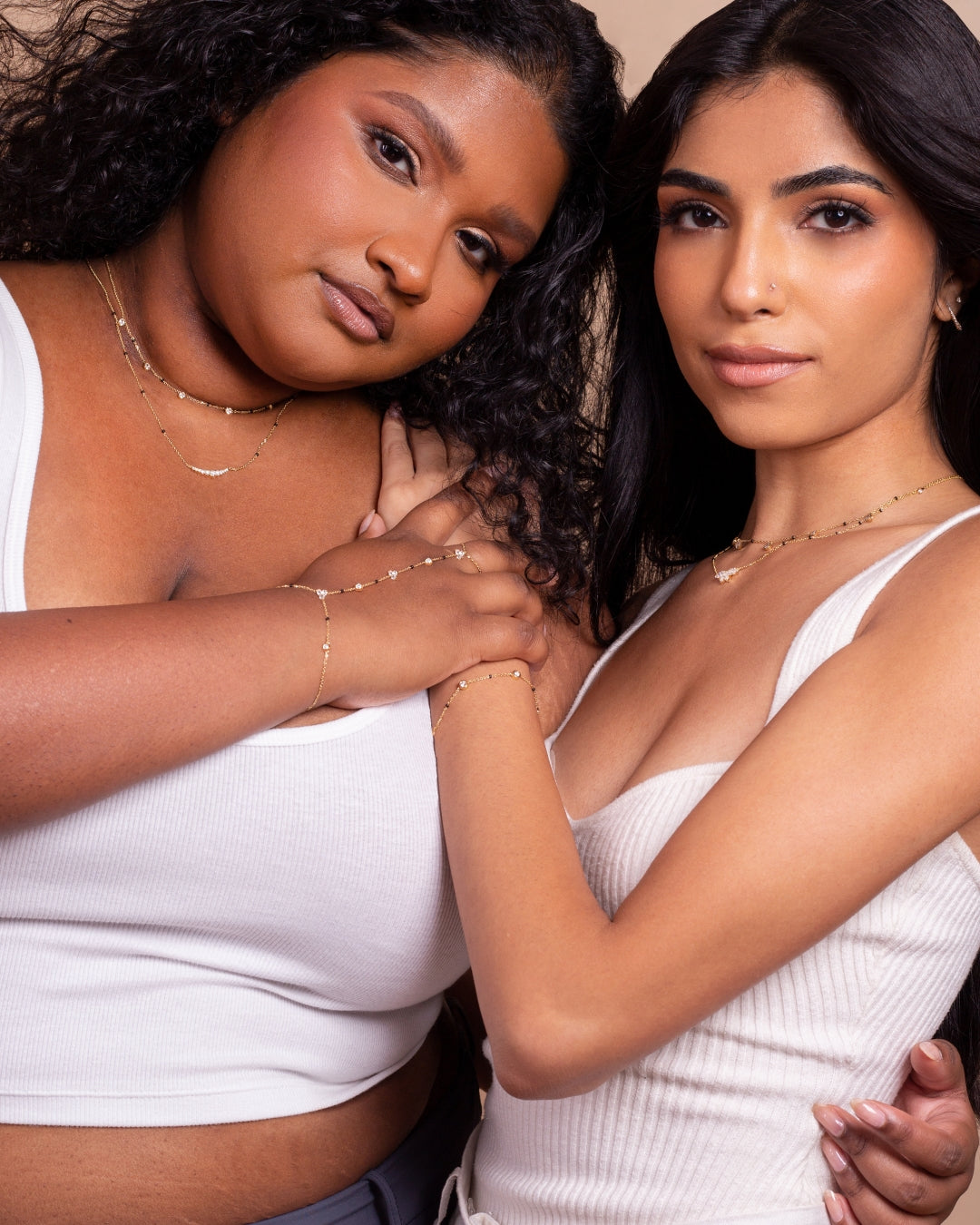 Two models showcasing necklaces and bracelets from The Modern Mangal x Ashna Gray Ashna Collection, symbolizing the blend of tradition and modern elegance. Each piece represents timeless heritage and individuality, crafted for both beauty and strength beyond bridal days.