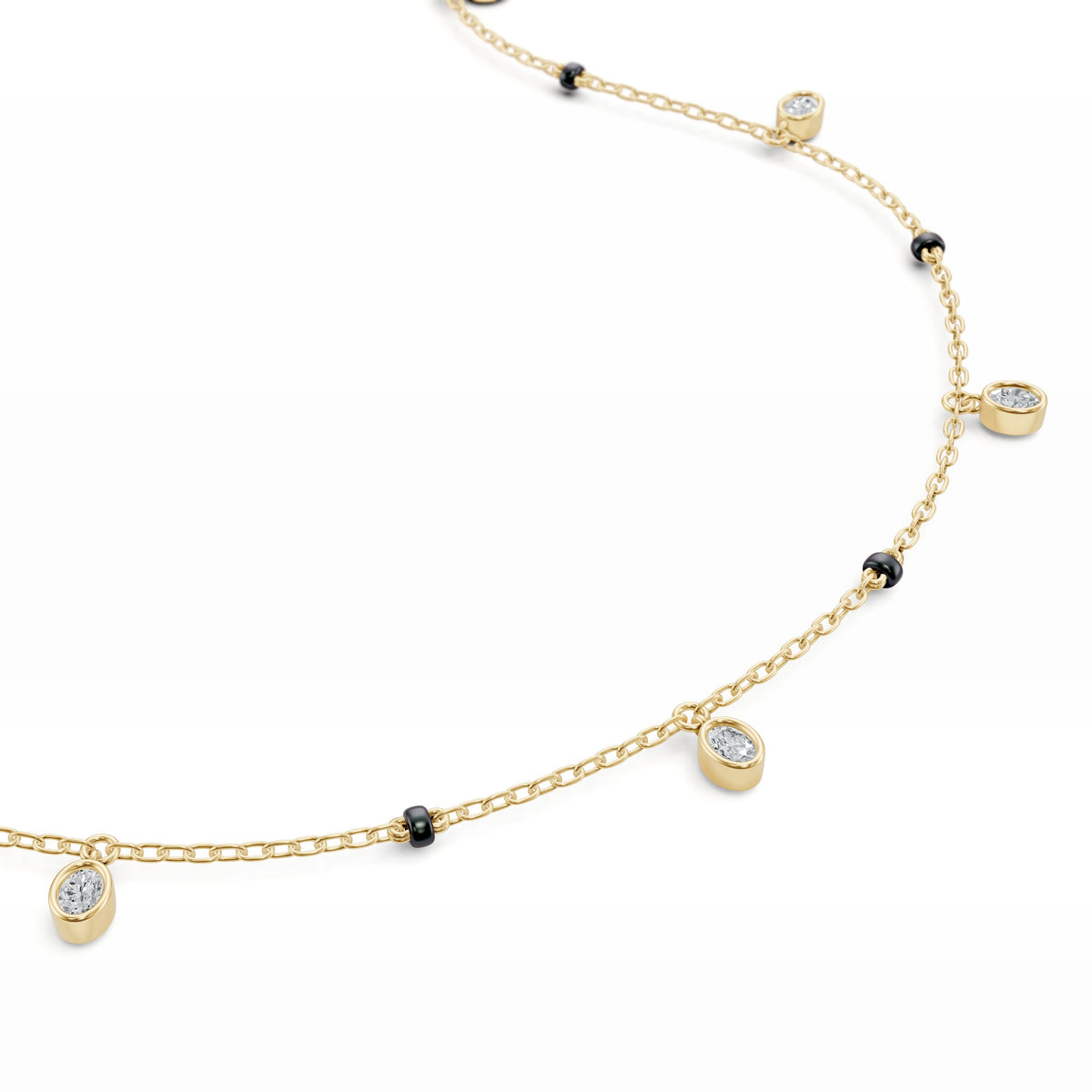 Close-up of the dangling bezel-set oval lab-grown diamond on the Ashna Mangalsutra in 18K yellow gold