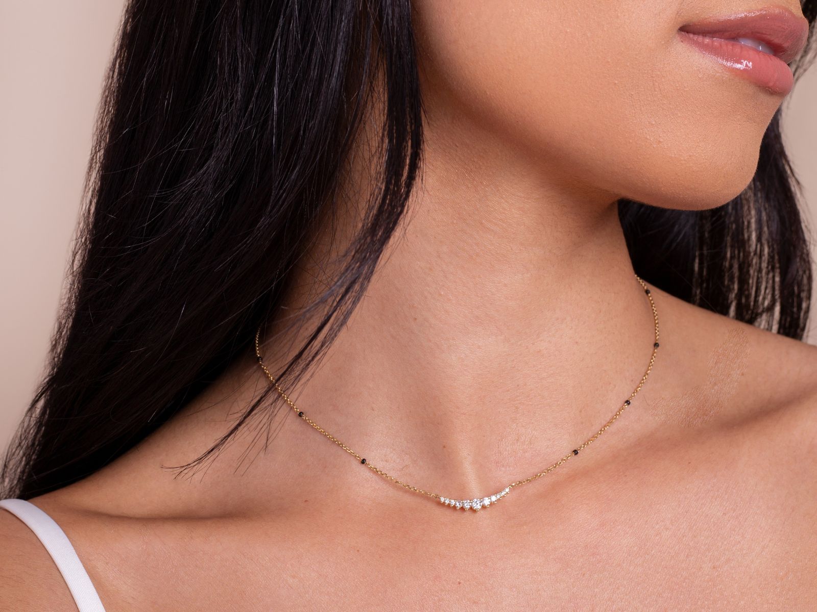 Model wearing the Harmony Necklace from the Modern Mangal x Ashna Gray Collection, showcasing an elegant gold chain with subtle diamond accents, designed for simplicity and elegance.