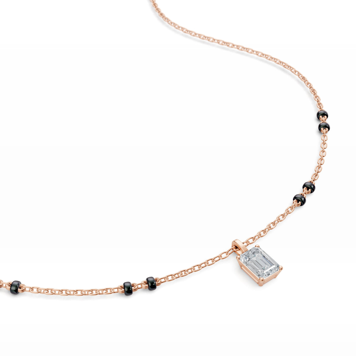 Close-up of the emerald lab-grown diamond on the Manjari Mangalsutra in 18K rose gold