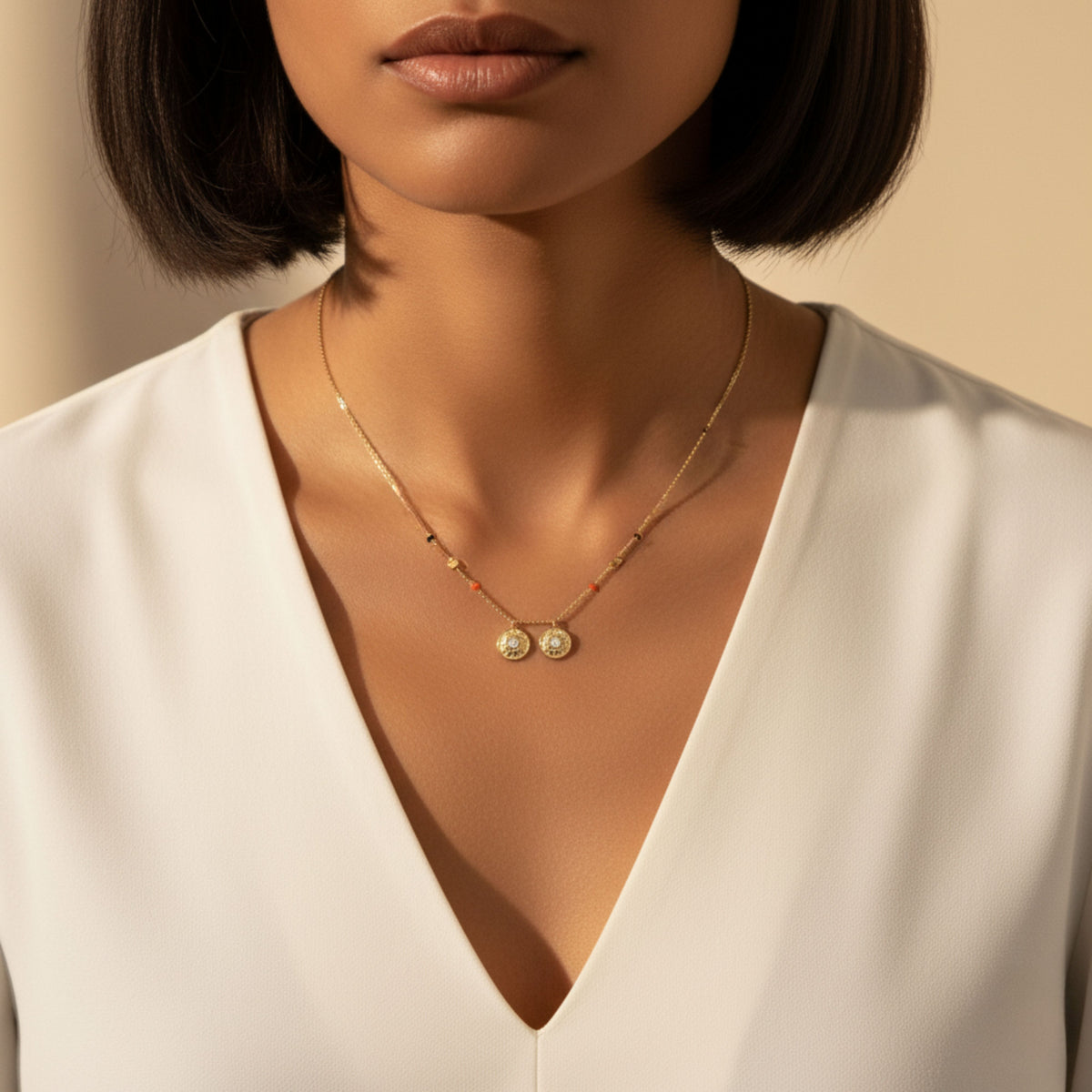 Model in a white V-neck blouse wearing the Neha Thaali in 18-karat yellow gold at mid-neckline length.