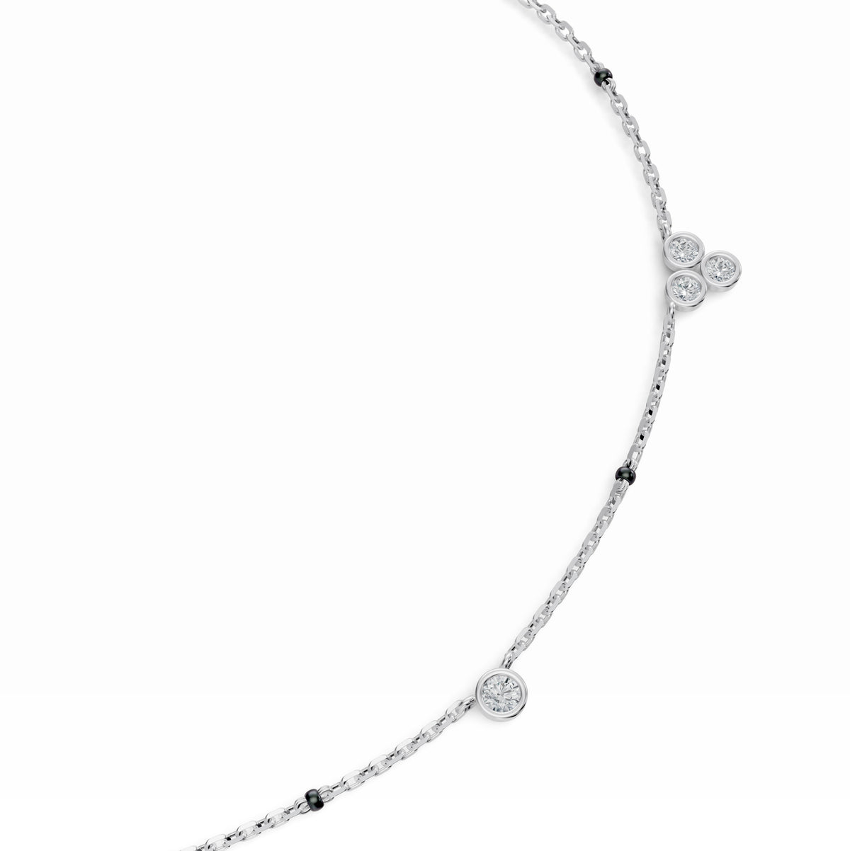 Close-up of the bezel-set diamond stations on the Nidhi Mangalsutra in 18K white gold