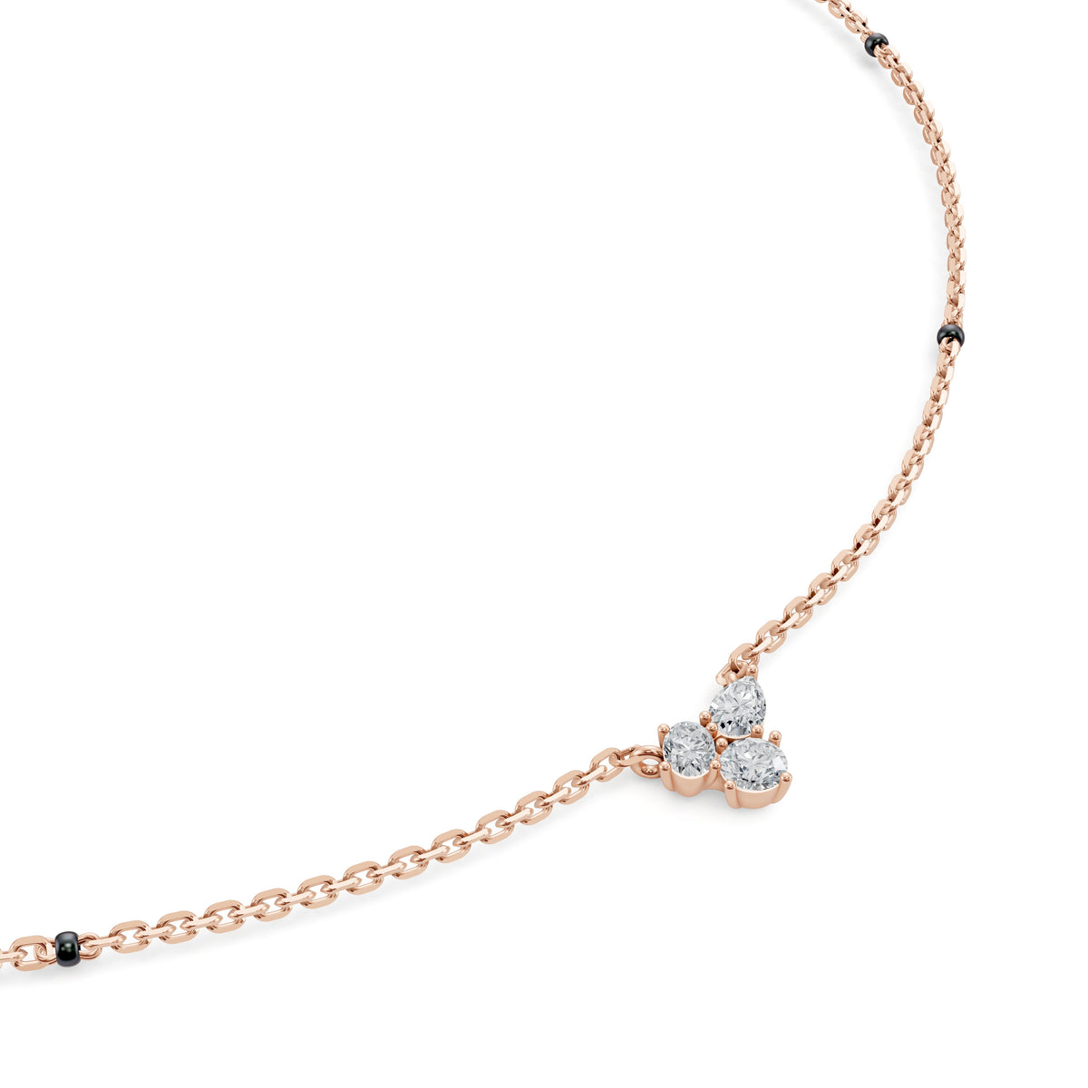 Close-up of the three-diamond cluster on the Reema Mangalsutra in 18K rose gold
