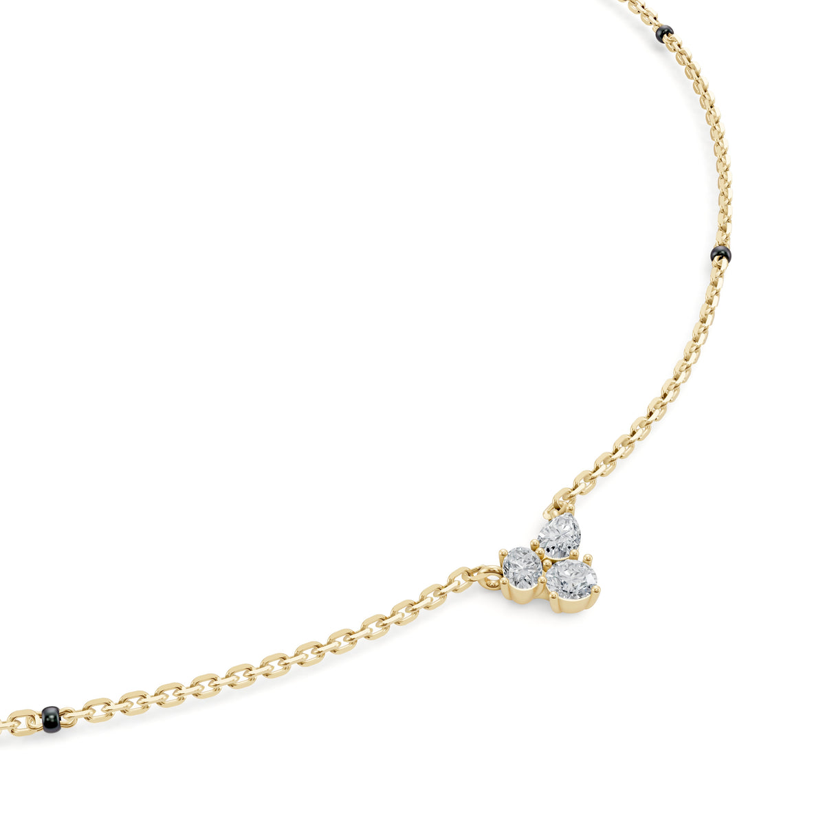 Close-up of the three-diamond cluster on the Reema Mangalsutra in 18K yellow gold