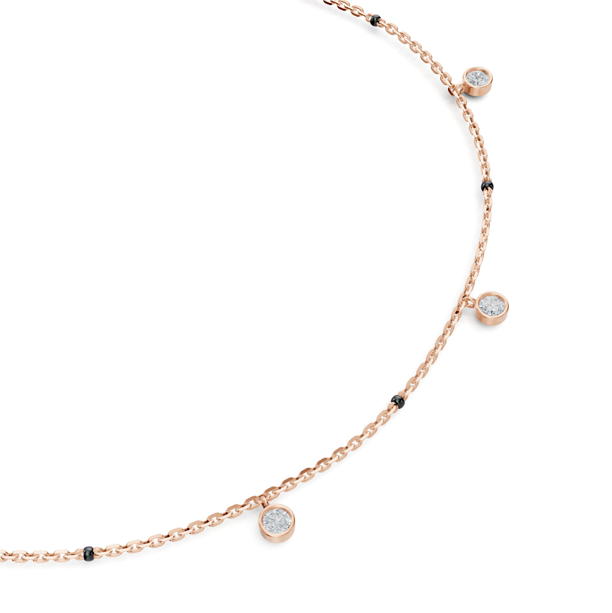 Close-up of the dangling bezel-set round lab-grown diamonds on the Sanjana Mangalsutra in 18K rose gold