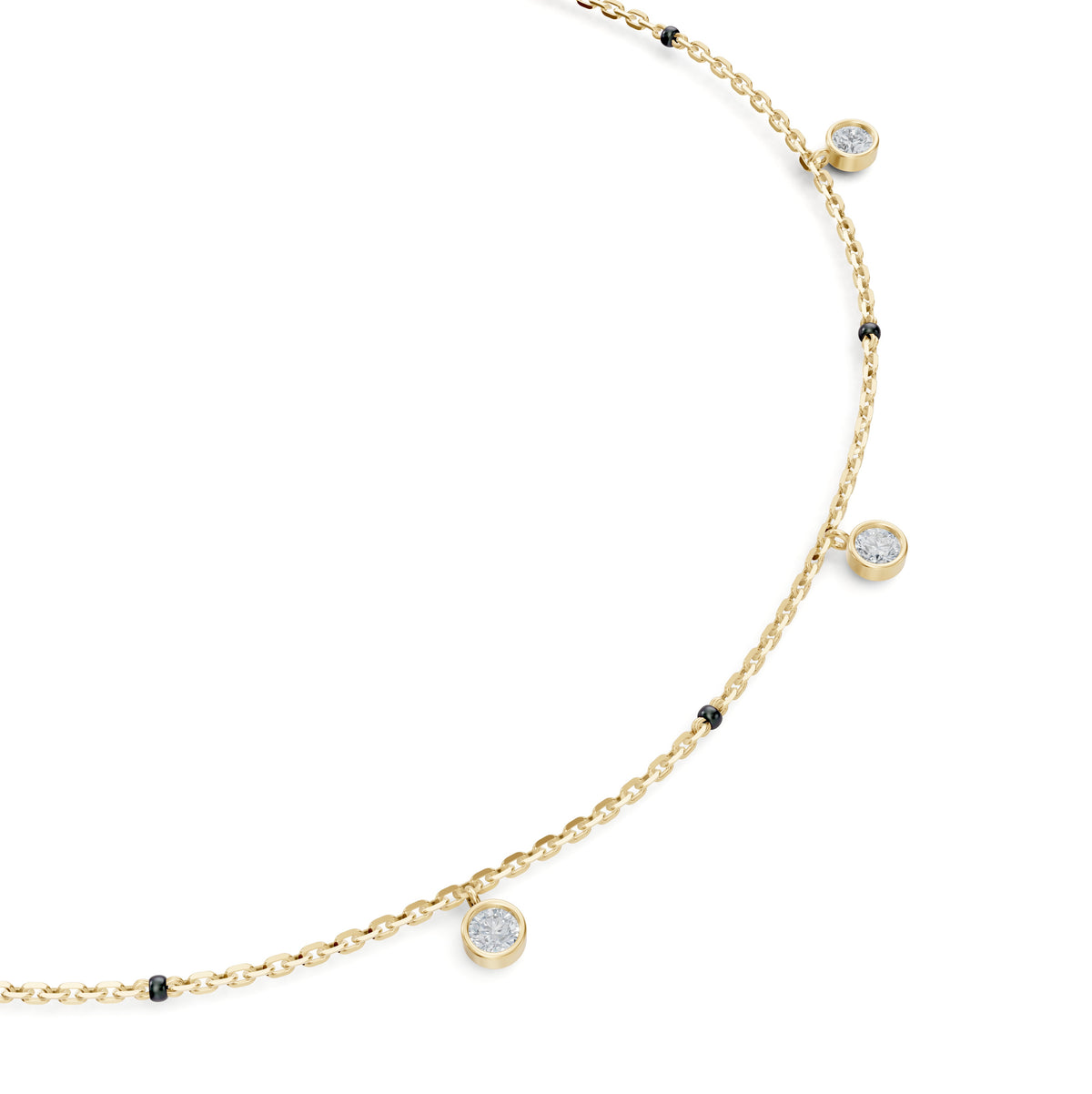 Close-up of the dangling bezel-set round lab-grown diamonds on the Sanjana Mangalsutra in 18K yellow gold