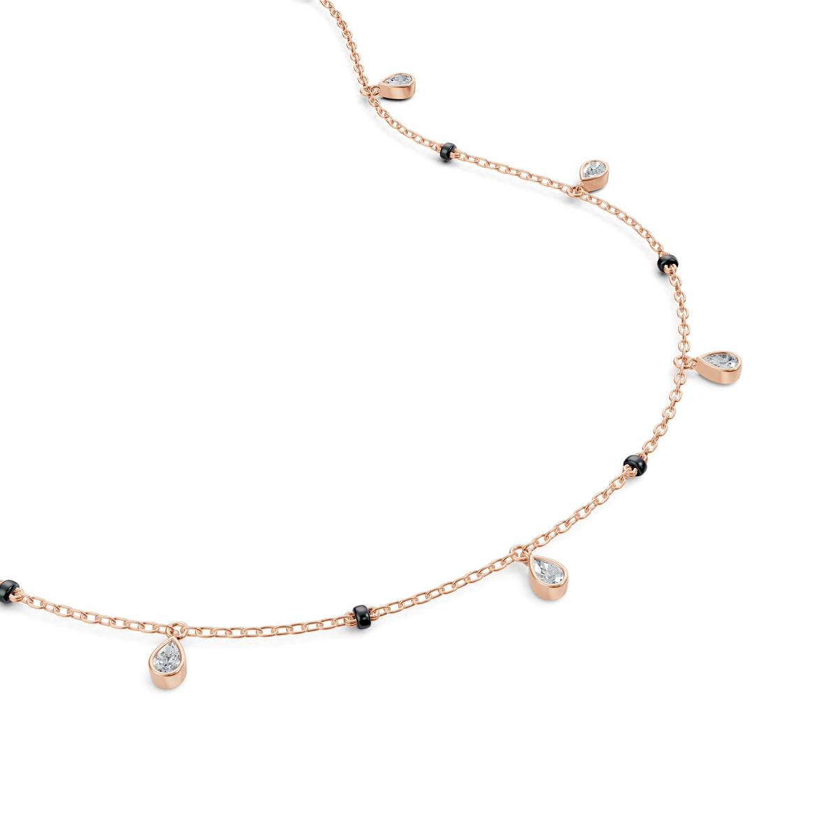 Close-up of the dangling bezel-set pear lab-grown diamonds on the Shivani Mangalsutra in 18K rose gold