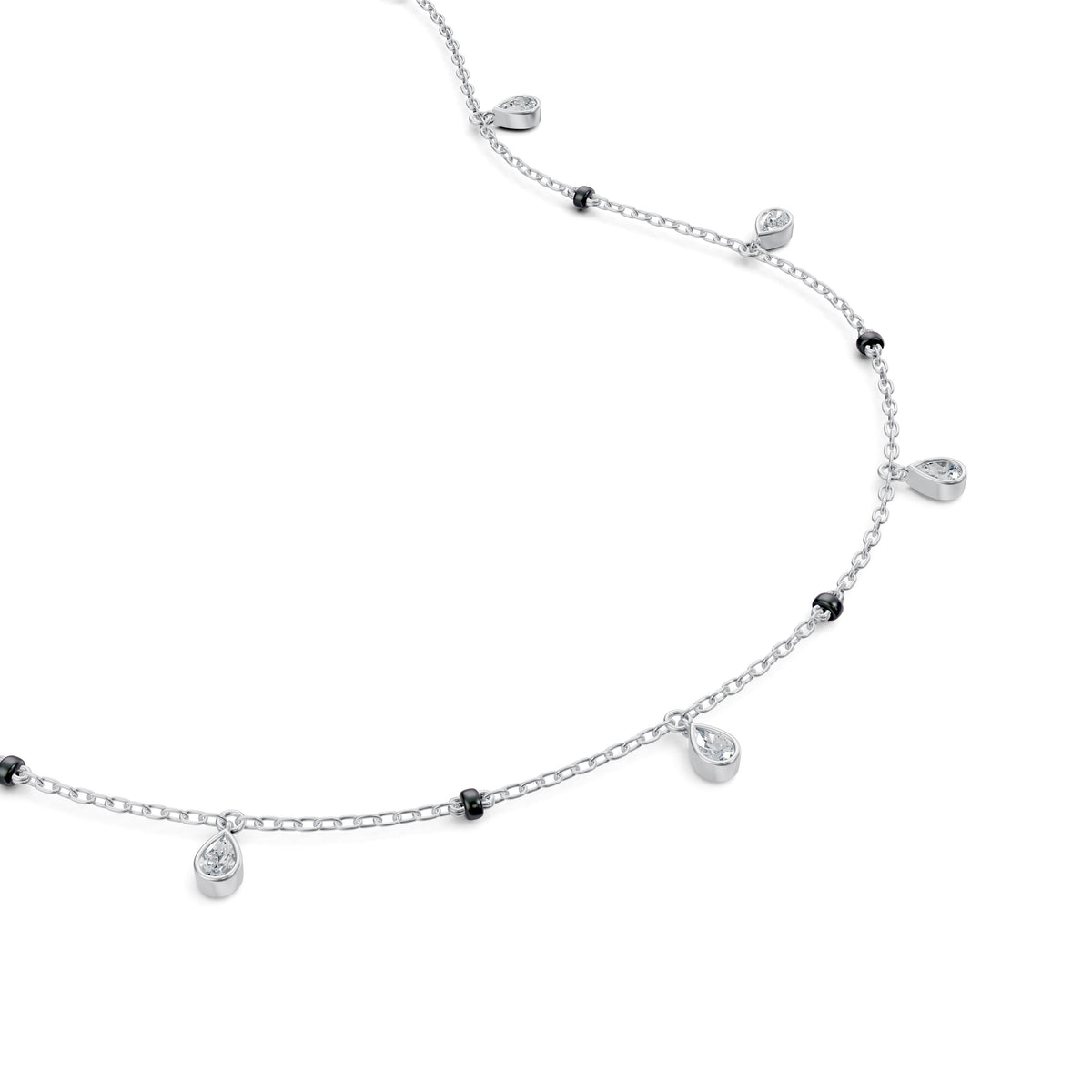 Close-up of the dangling bezel-set pear lab-grown diamonds on the Shivani Mangalsutra in 18K white gold