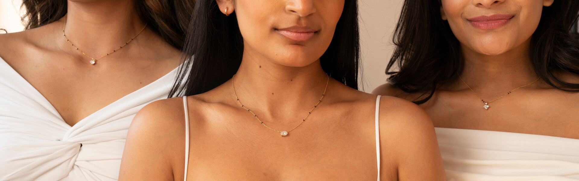 Three diverse women wearing Modern Mangalsutra necklaces, showcasing unity and elegance.