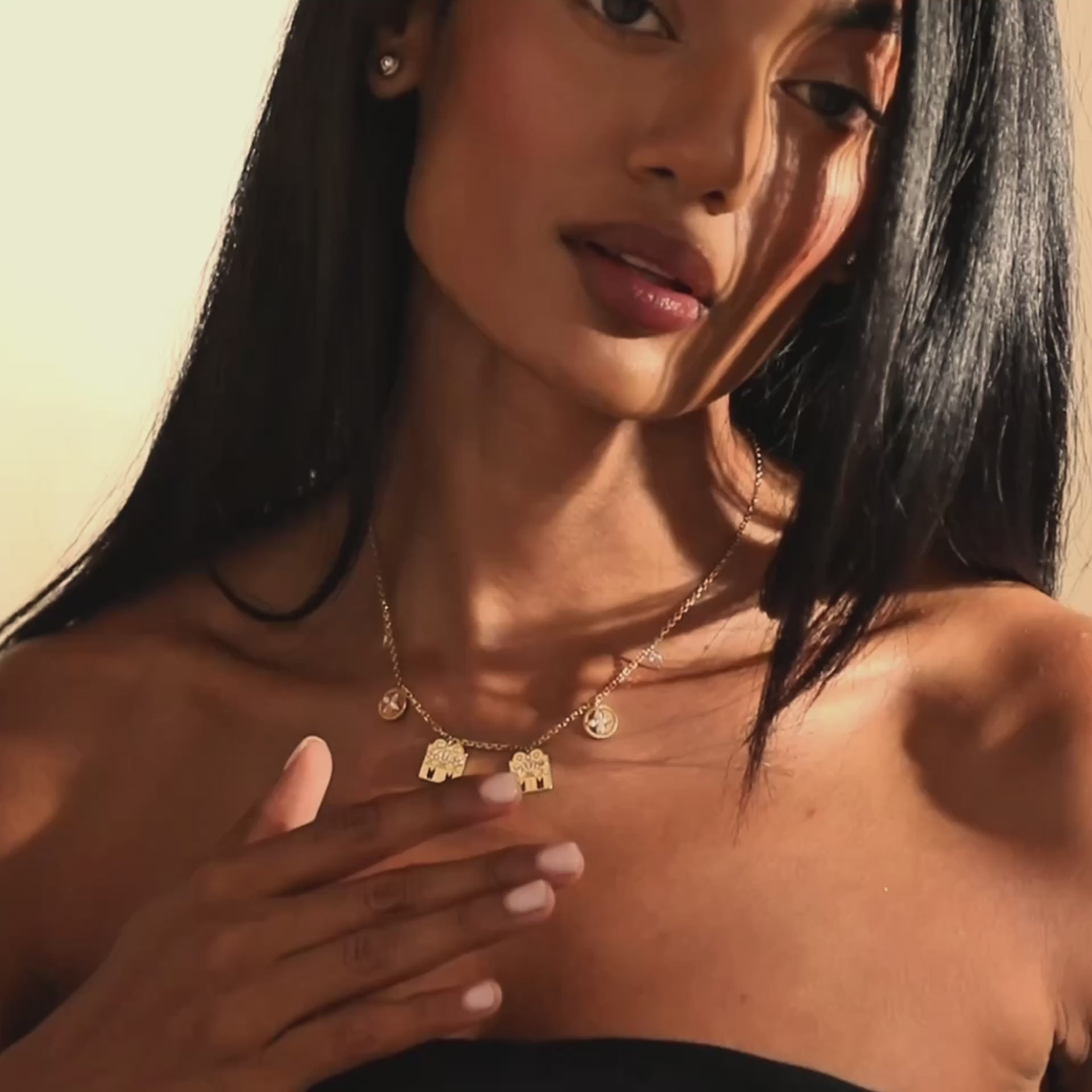 Close-up of model wearing yellow gold Modern Mangal Monica Mangalayam with diamond Shivling centerpieces and symbolic charms showcasing Tamil traditions in contemporary style.