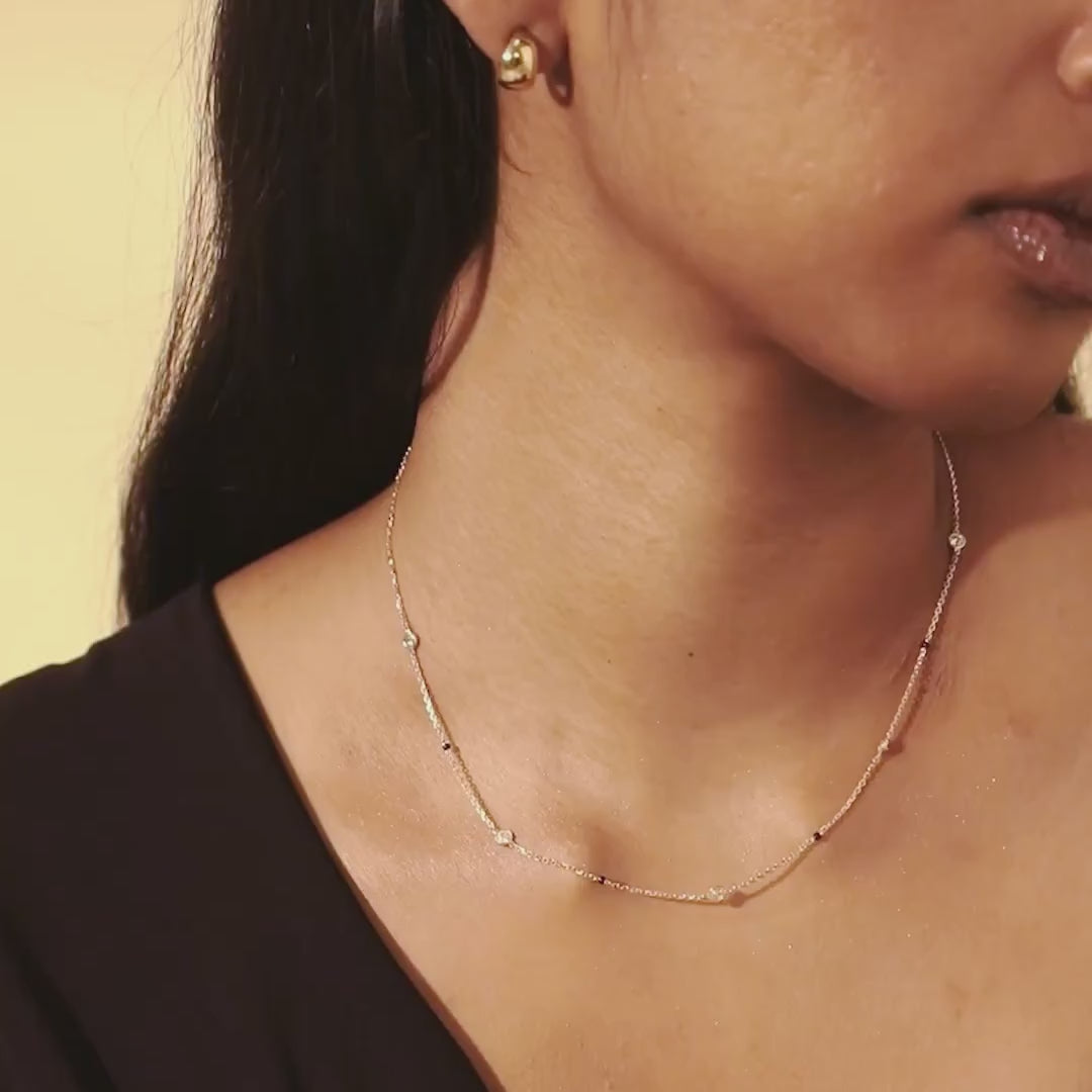 Model video of the Modern Mangal Alia Mangalsutra in yellow gold, with the round diamond pendant catching the light and the spaced bead strands moving naturally.