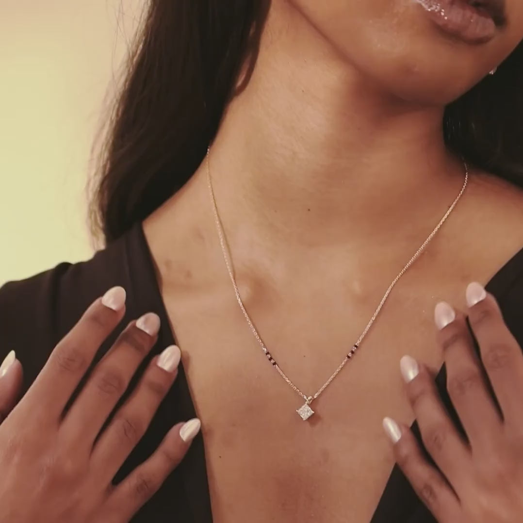 Model wearing the Modern Mangal 
 yellow gold Chandni Mangalsutra in motion, with the diamond pendant swaying subtly and catching light beautifully.